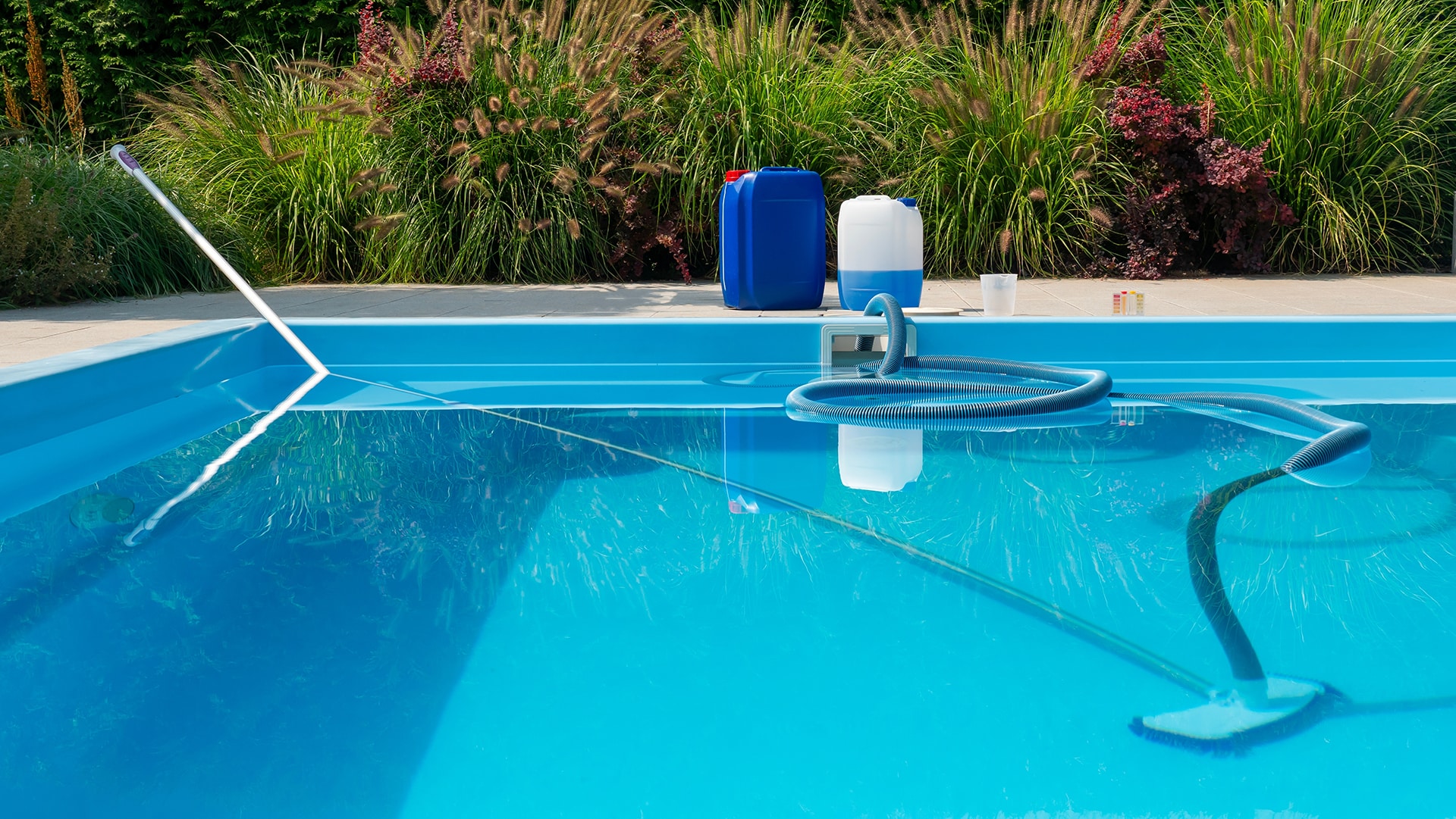 Outdoor swimming pool cleaning equipment and supplies.