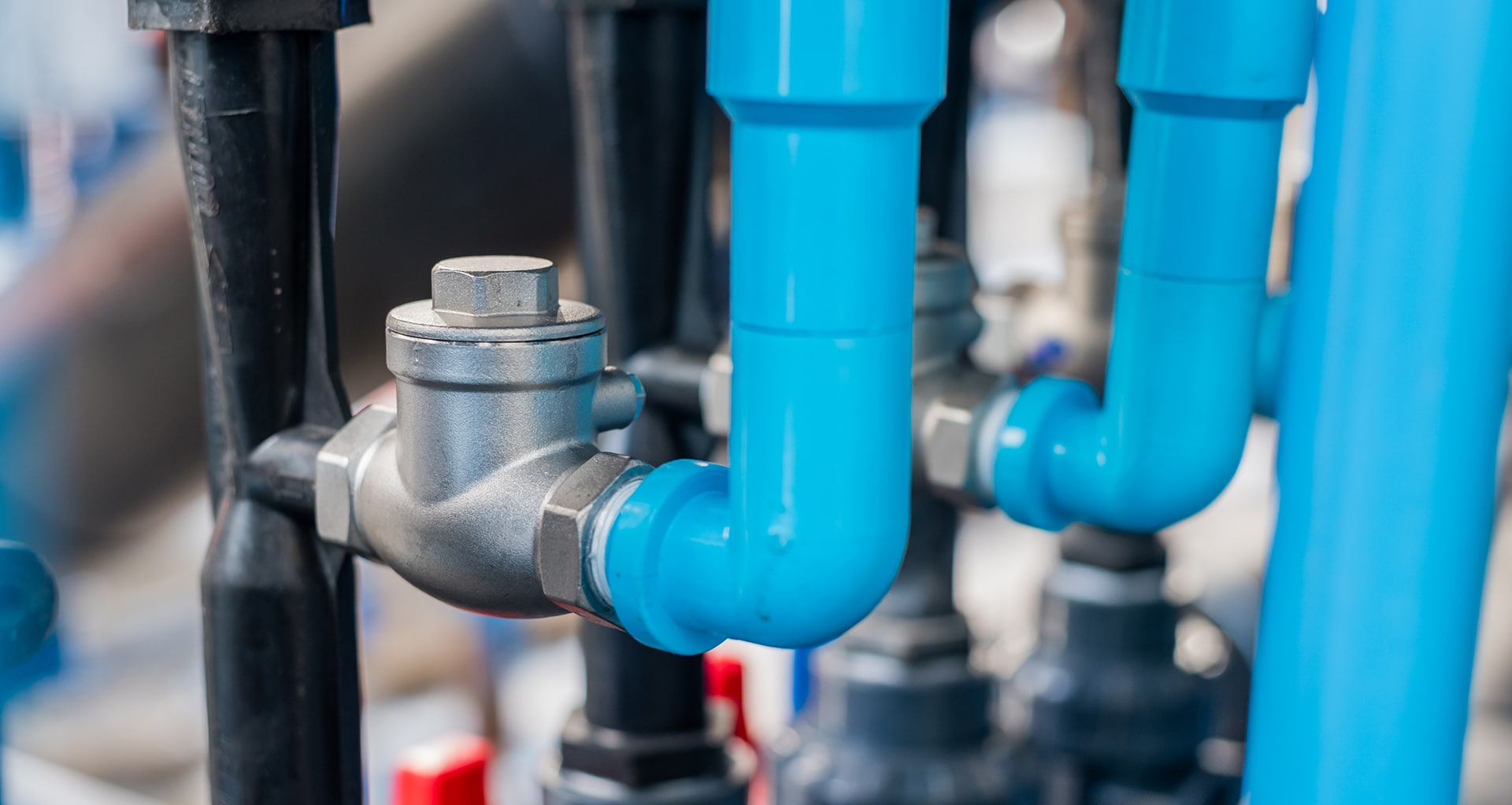 Close-up of industrial pipes and metal valve