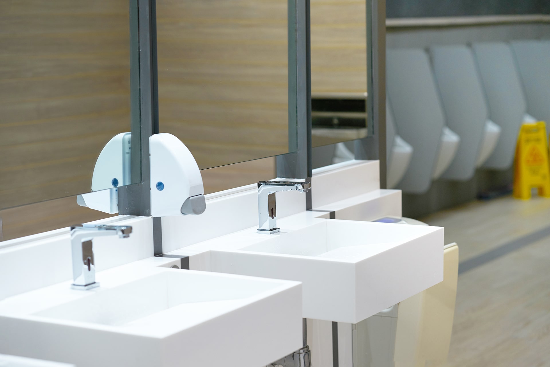Modern public restroom with sinks and mirrors