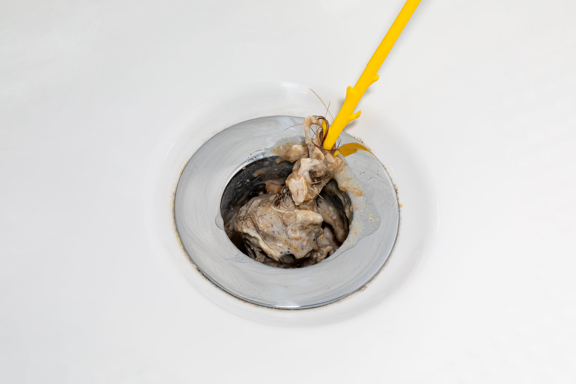 Removing hair clog from bathtub drain