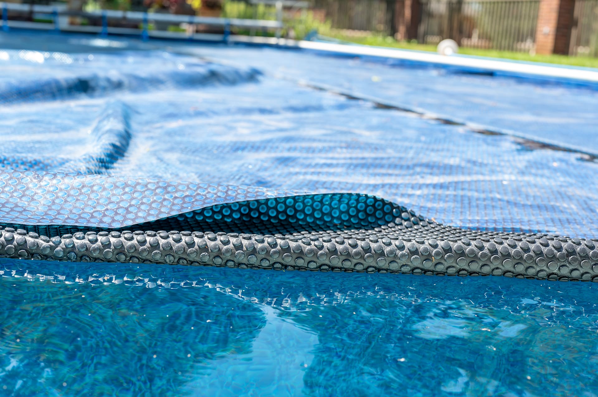 Close-up of blue solar pool cover.